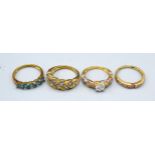 A 9ct. Gold Dress Ring set five blue stones together with three other 9ct. gold dress rings