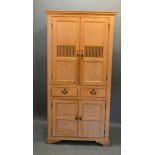 A Late 19th Century Pine Housekeeper's Cupboard, the moulded cornice above two panel doors and two