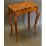 A French Marquetry Inlaid and Gilt Metal Mounted Side Table, the shaped top above a frieze drawer