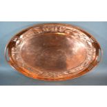 An Arts and Crafts Newlyn Copper Tray of oval pierced form, the embossed border in the form of fish,