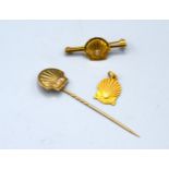 A 9ct. Gold Bar Brooch in the form of a Scallop Shell set solitaire diamond, together with another