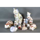 A Royal Worcester Porcelain Model of a Cat decorated in the Imari Palette together with a pair of