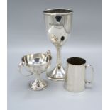 A London Silver Presentation Goblet together with a white metal two handled trophy cup and a white