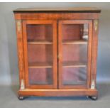 A Victorian Walnut Marquetry Inlaid Gilt Metal Mounted Pier Cabinet with two glazed doors