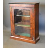 A Victorian Walnut Marquetry Inlaid and Gilt Metal Mounted Pier Cabinet with a glazed door enclosing