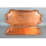 An Arts and Crafts Copper Tray by Eustace Brothers 56 x 276 cms together with another similar Arts