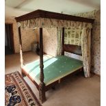 A Mahogany Four Poster Bedstead with carved reeded turned pilasters