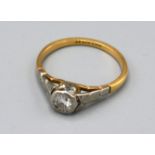An 18ct. Gold and Platinum Set Solitaire Diamond Ring, size L, 2.1 gms