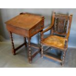 A Victorian Carved Oak Clerk's Desk with barley twist legs and stretchers together with a matching