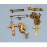 A 9ct gold brooch in the form of a seahorse, three 9ct gold bar brooches and two 9ct gold crucifix