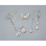 A Collection of Four Silver Pendants with chains together with a silver brooch in the form of a
