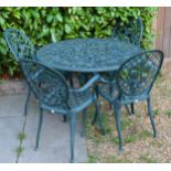 An Aluminium Painted Garden Table with four matching armchairs