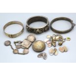 A silver charm bracelet together with an Indian bangle and other related items