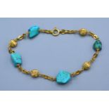 An 18ct gold bracelet set with natural turquoise, 7.5gms, 20cms long