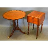 A Mahogany Occasional Table with a shaped top above a triple turned column support with outswept