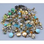A large collection of earrings and earclips