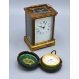 A Brass Cased Carriage Clock together with a compensated barometer by Negretti & Zambra London