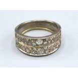 An 18ct. White Gold Double Band Ring set with two rows of diamonds, ring size Q, 7.4 gms.