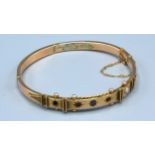 A 9ct. Gold Bangle set stones 9 gms.