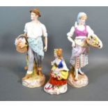 A Pair of Late 19th century German porcelain figures "The Flower Sellers" 22cm tall together with