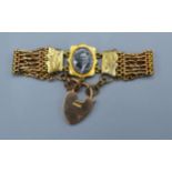 A 9ct. Gold Gate Link Bracelet with padlock clasp with central locket 18.9 gms