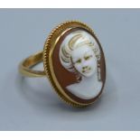 A 9ct. Gold Cameo Ring decorated in relief with a classical figure, ring size N, 3.4 gms.