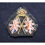 British WWI Patriotic Sweetheart Badge, the deign of two Union Flags with gold braid with a KC