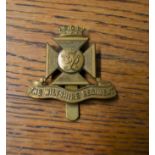 The Wiltshire Regiment Cap Badge (Gilding-metal), slider.