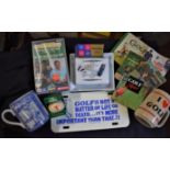A good selection of vintage golfing memorabilia mugs including a Guinness Butter plate, books, VHS