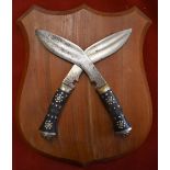 Gurkha Rifles Army Cross Placard in the design of two crossed Kukri daggers mounted on a wooden