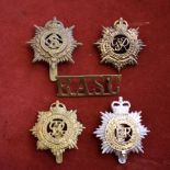 British Cap Badges (4) and Shoulder Title including: Army Service Corps, Royal Army Service Corps (