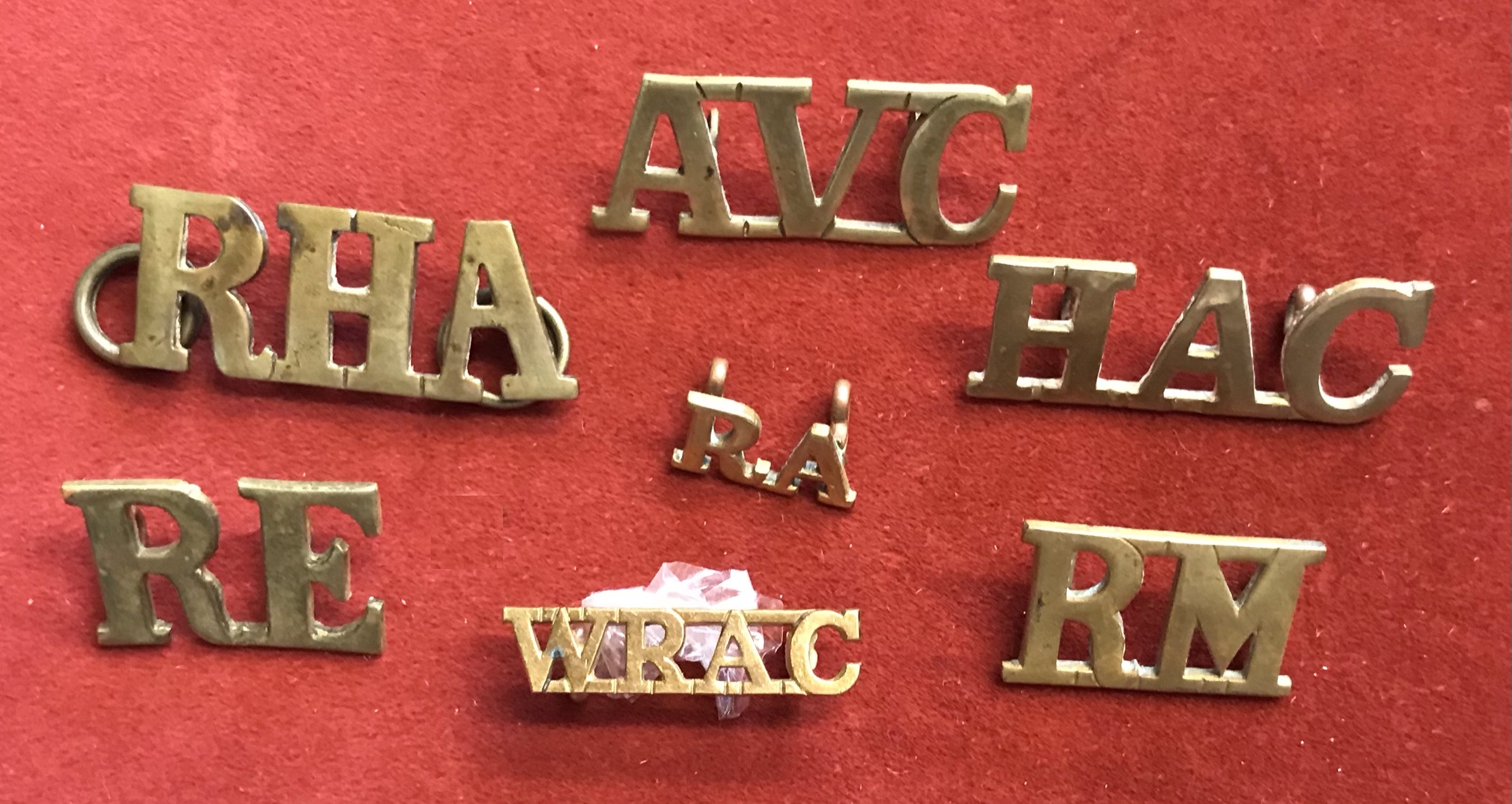 British Shoulder Titles (7) including: Royal Horse Artillery, Royal Engineers, Royal Marines,