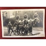 British WWI Bedfordshire Regiment RP Postcard, shows a group photo of eight soldiers around a