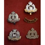 Suffolk Regiment Cap Badges (4) and a Shoulder Title including, QVC type, WWI/II Cap Badge,