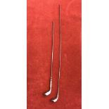 A pair of silver plate golf club hat pins dated 1910-1920's