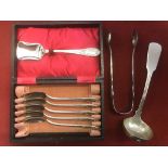A set of metal spoons in a presentation box, a ladle and tongs silver/silver plated