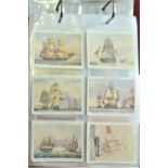 Naval Ships and Shipping. A collection in an album, all in sleeves with Postcards, Cigarette & Trade