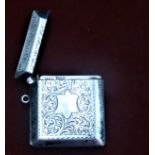 Edwardian Vesta Case, a larger silver Vesta case with a floral etch surrounding a central shield,