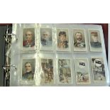 Military. A collection of cigarette cards & trade cards old and reproduction (Taddy etc) in an album