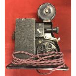 Toy 9.5 Movie Projector made c1925 in wooden carry box and three Pathescope 9.5 Move Reels including