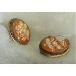 Two fine Cameo Brooches with a matching pair of cameo earrings set in silver. Beautiful floral