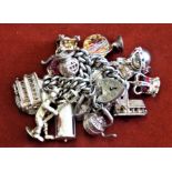 A silver curb chain bracelet with padlock fastener and 6 charms 15.4 grams, very fine