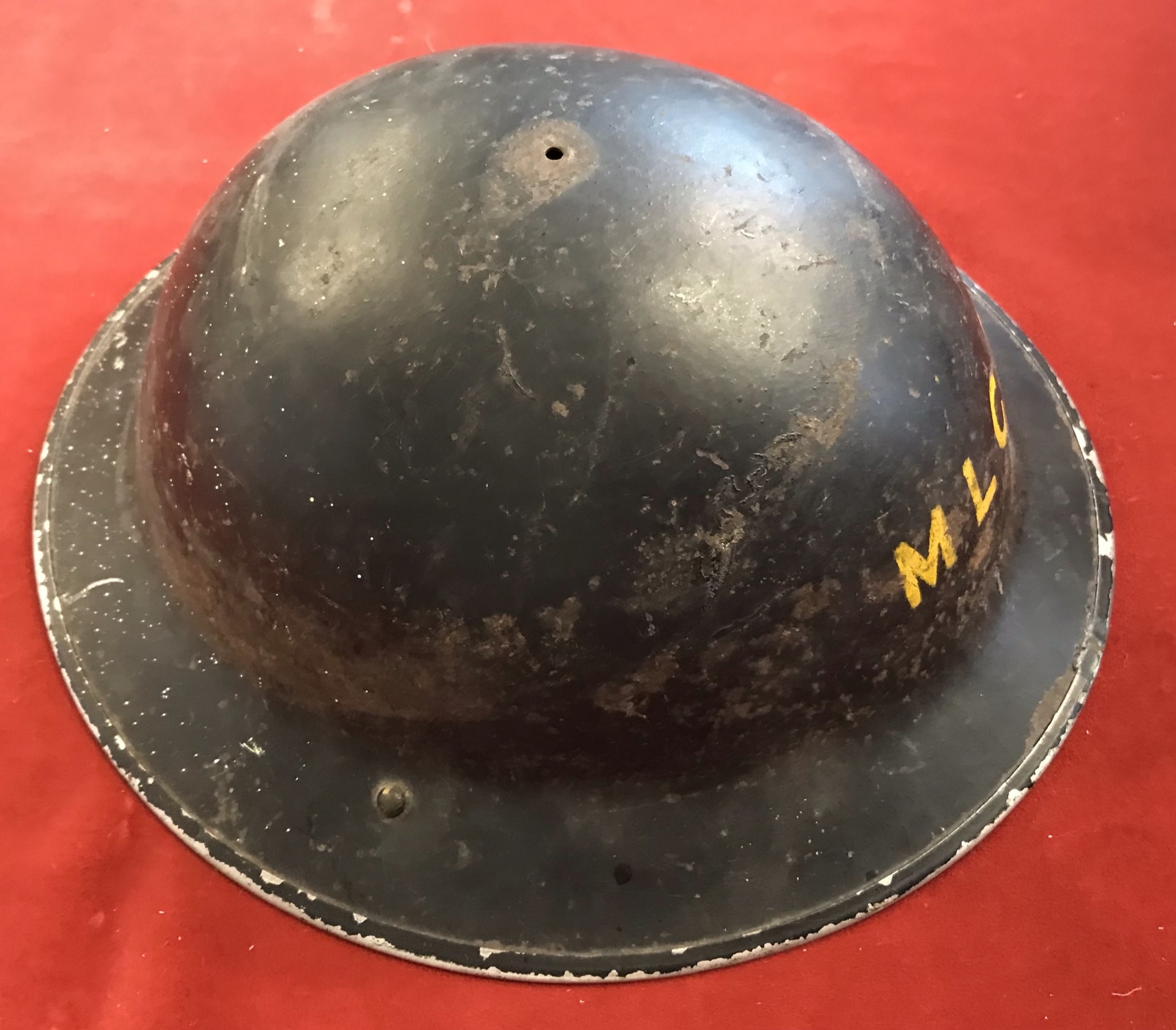 British WWII MLCD (Midlands) Civil Defence Helmet, painted black with 'MLCD' painted on the front in