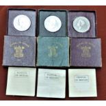 1951 Festival of Britain Crowns, cased two maroon and one green (3)