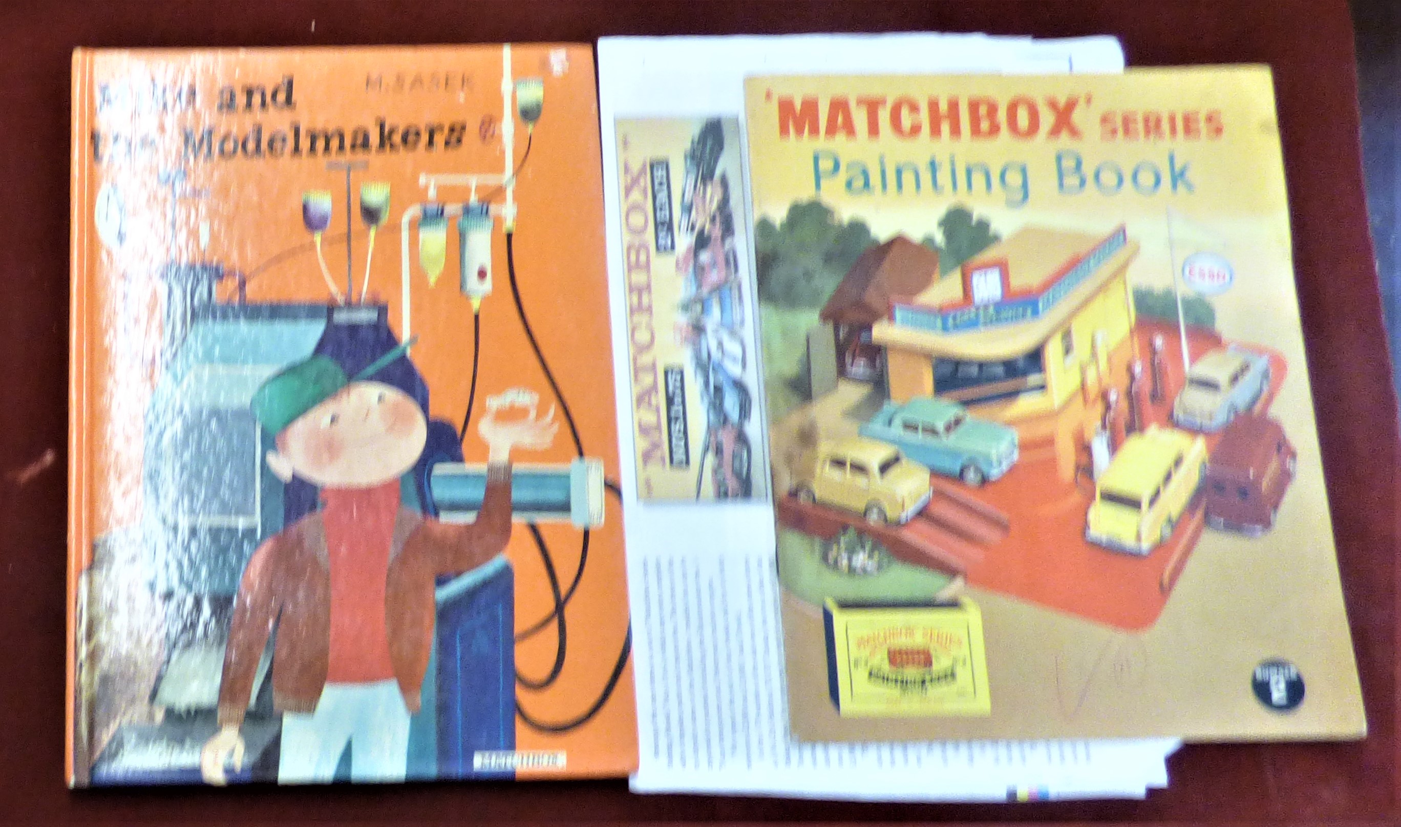 Matchbox Toys painting book No.2, very good condition and Mike and the Modelmaker hardback, the