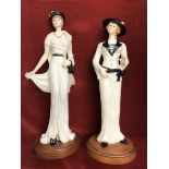 Ladies of Fashion (2) statue figurines dressed in early 20th Century costume. Both mounted on wooden