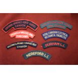 British Cloth Shoulder Titles (7) including: Durham Light Infantry, Hereford Light Infantry,