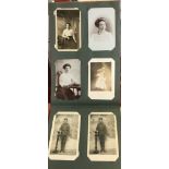A WW1 postcards collection in an album, range of military RP postcards, nurses, family portraits