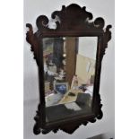 English fretwork Mahogany wall mirror dating to the mid 18th century. The mirror frame is formed