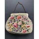 1920/30s needlepoint floral bag, beautiful condition, brass embossed frame and strap, satin lining.